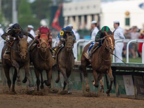 Mystik Dan (far right) holds off Sierra Leone (far left) and Forever Young (red hood) to win the 150th Kentucky Derby (G1) - Nicole Finch