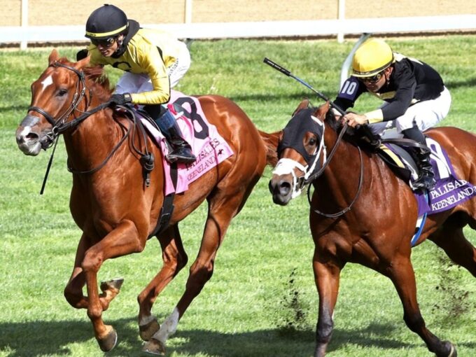 Reb Five, at left, rolls by Throckmorton in the final strides of Keeneland's Palisades S. - John Gallagher