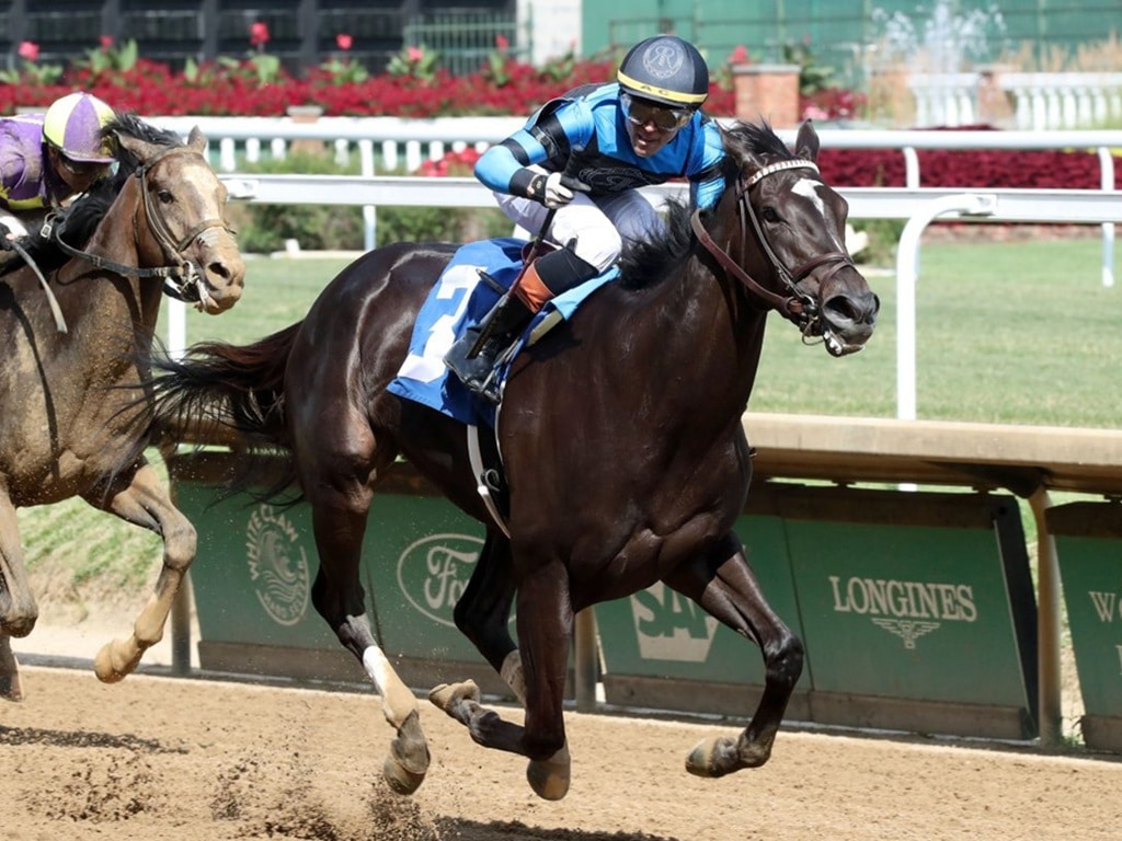 Axel Concepcion celebrates La Rascasse's victory in the Monomoy Girl S. - Renee Torbit/ Coady Media